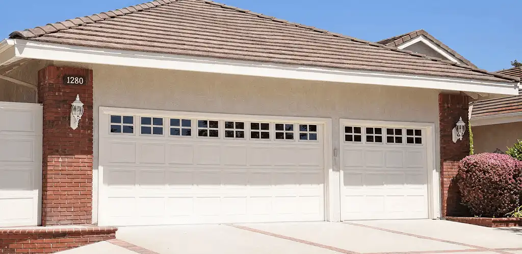 Residential garage door repair service for a double garage door in Eugene, OR